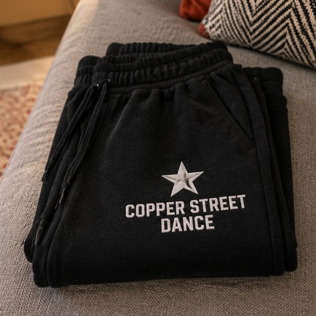 Customer photo of custom sweatpants on a couch